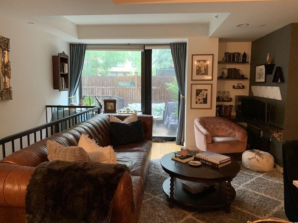 Chic Manhattan Condo with Private Backyard - Tap to explore photos