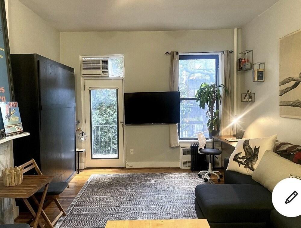Stylish studio next to it all with Balcony and Trees - Tap to explore photos