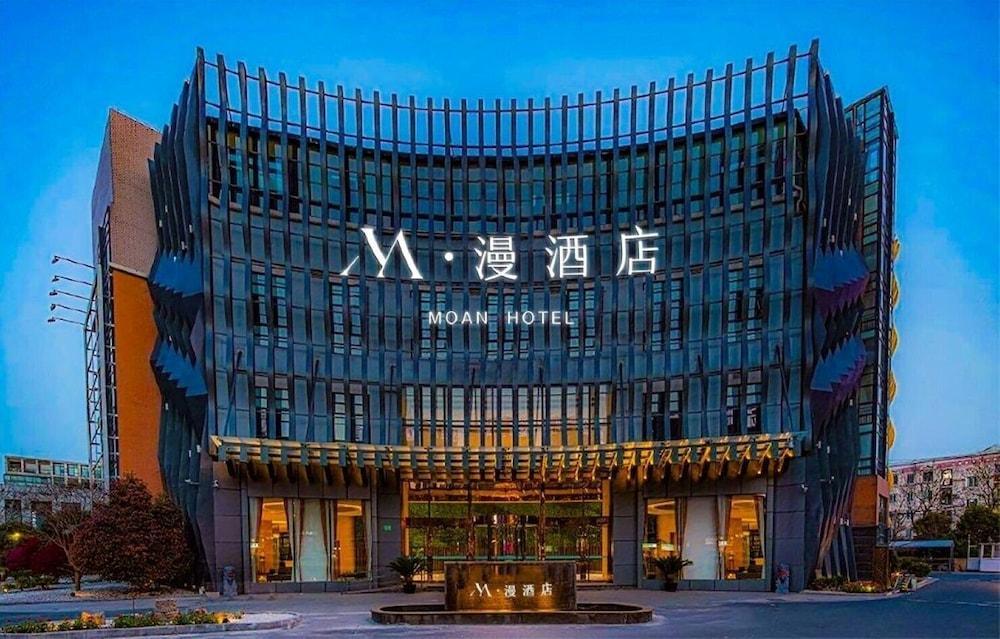 M Man Hotel - Tap to explore photos
