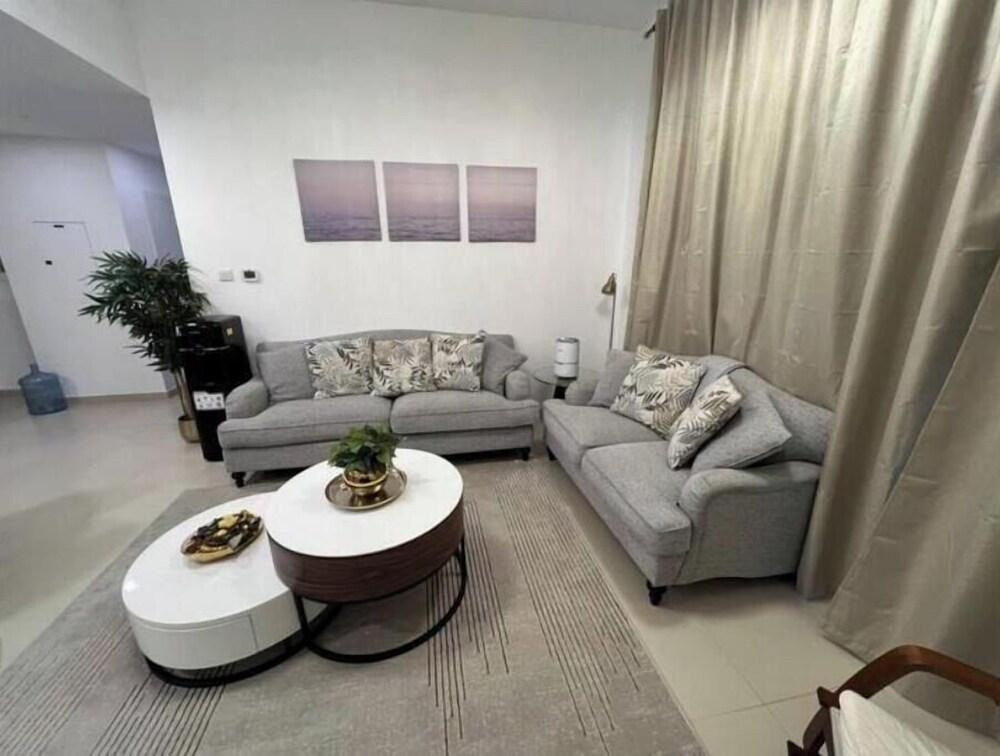 Luxury 2BR w/ Pool, Gym & Balcony – Zahra Breeze - Tap to explore photos