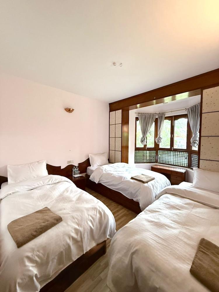 Laavanya Inn Room Type - Economy Triple Room, Garden View