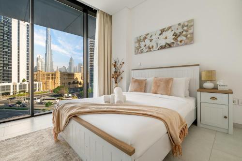 New! Spacious 2BR with Burj Views in Marquise Square - Tap to explore photos