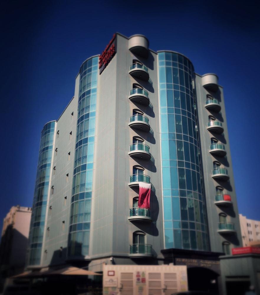 Al Madina Suites Doha - Tap to explore photos