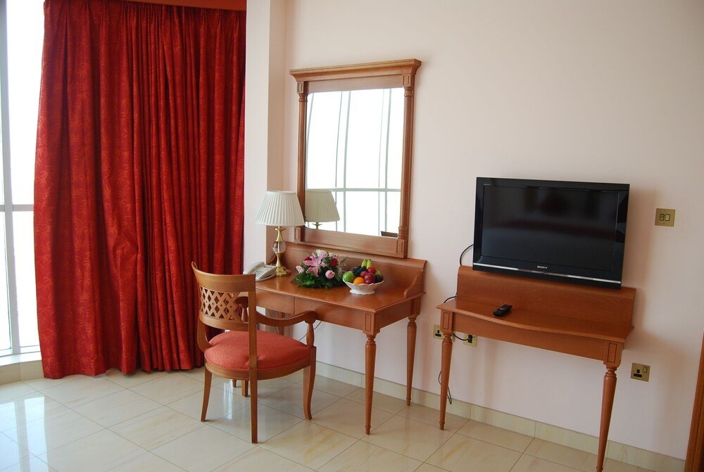 Al Madina Suites Doha - Tap to explore photos