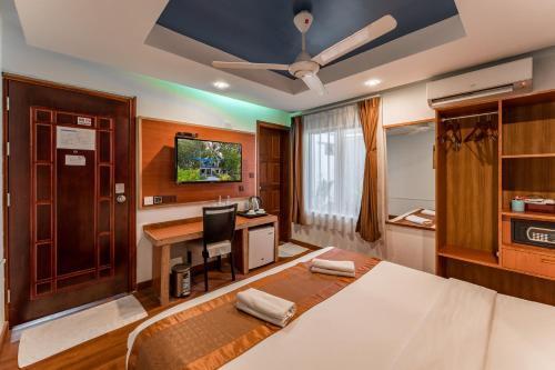 Maamadi Boutique Hotel - Tap to explore photos