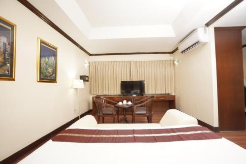 Grand Business Inn - Tap to explore photos