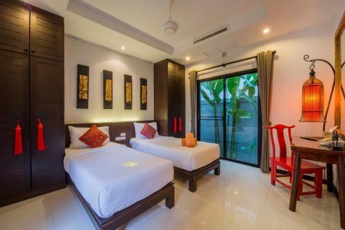 The Bell Pool Villa Resort - Tap to explore photos