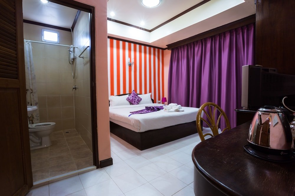 Hotel Grand Orchid Inn - Tap to explore photos