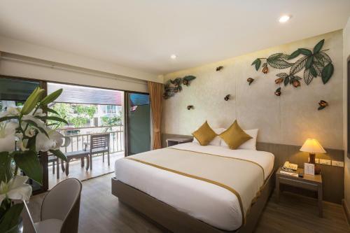 Chanalai Flora Resort Kata Beach Phuket - Tap to explore photos