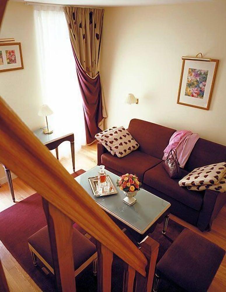 Htel Suites Unic Renoir Saint Germain - Tap to explore photos
