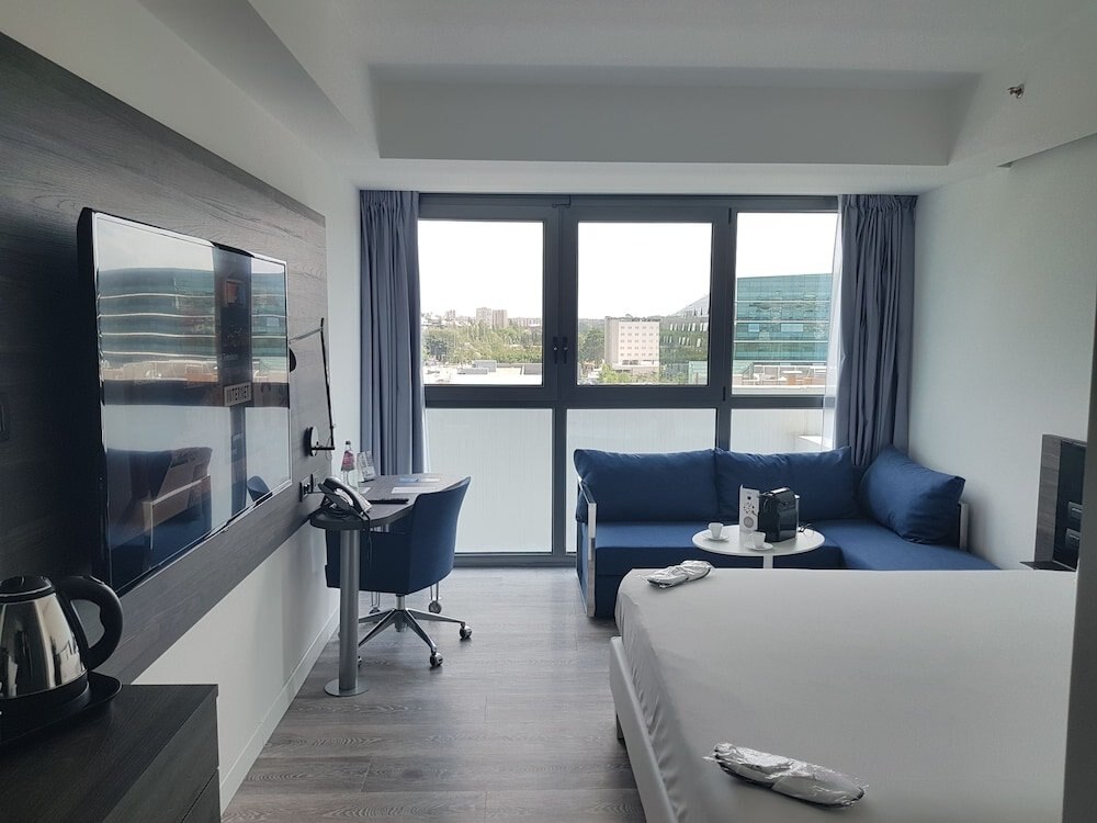 Novotel Roma Eur Room Type - Superior Room, 1 King Bed with Sofa bed Novotel Roma Eur Room Type - Superior Room, 1 King Bed with Sofa bed