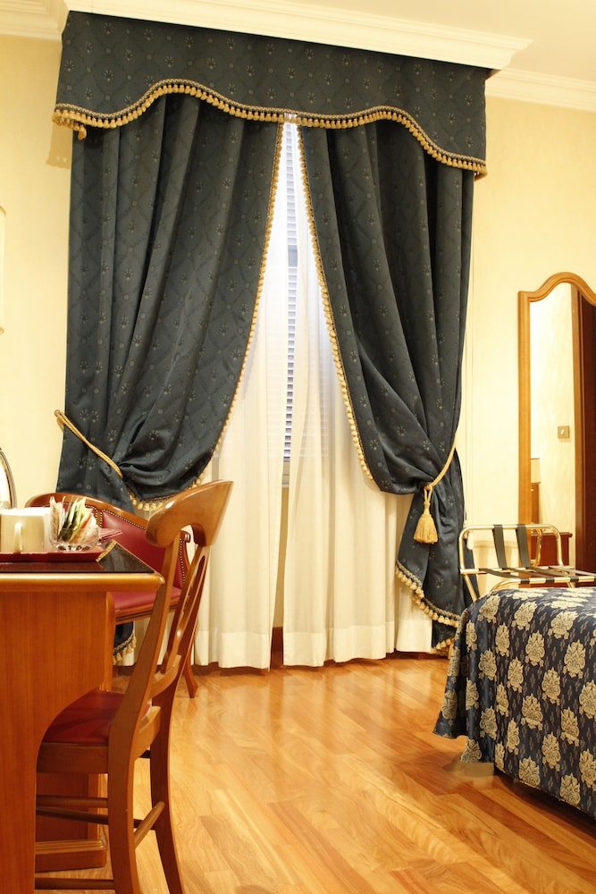 Hotel Genio - Tap to explore photos