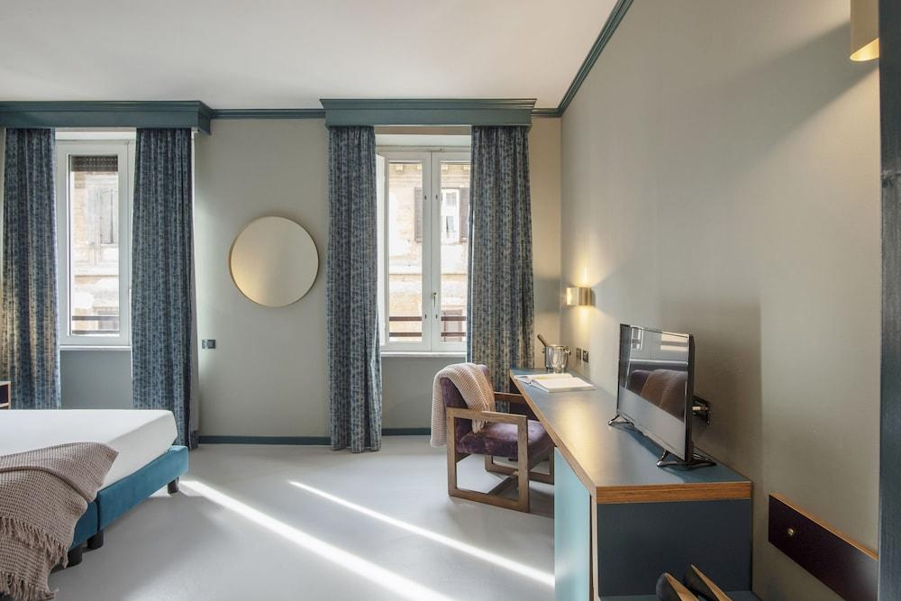 Hotel Milani - Tap to explore photos
