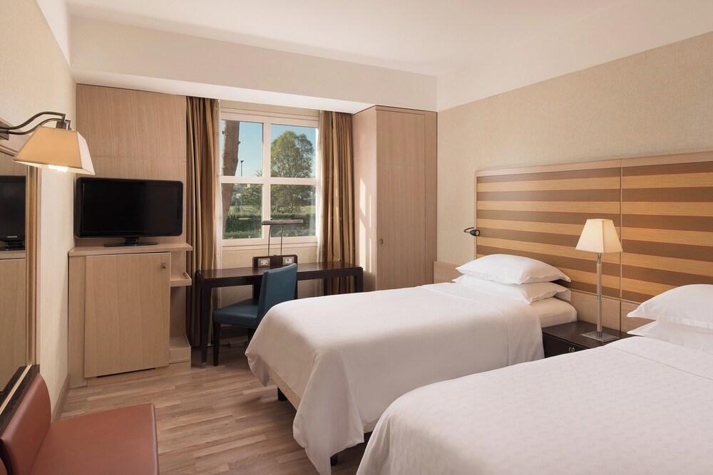 Sheraton Parco De' Medici Rome Hotel Room Type - Superior Room, 2 Twin Beds, Garden View Sheraton Parco De' Medici Rome Hotel Room Type - Superior Room, 2 Twin Beds, Garden View