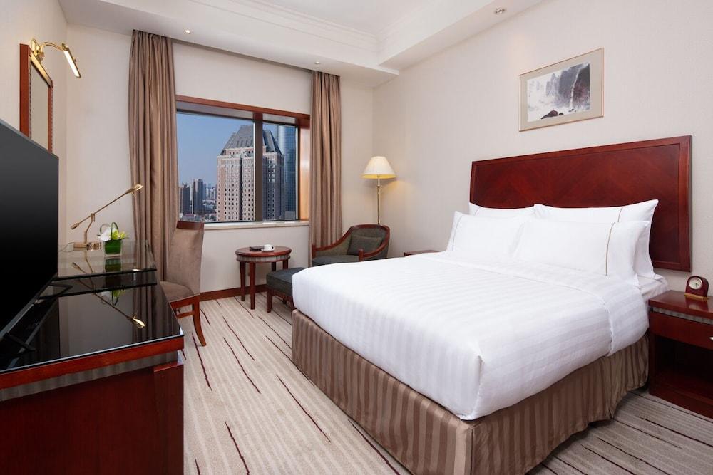 Jianguo Hotel Shanghai - Tap to explore photos