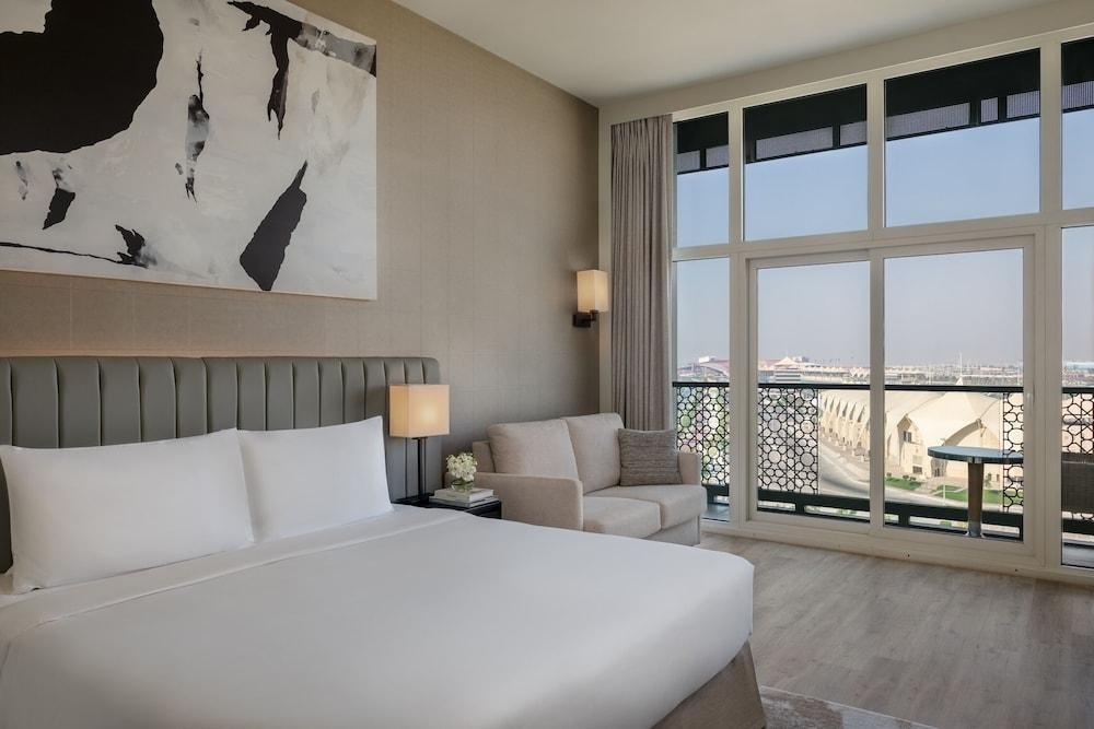 YAS PLAZA MARINA by IHG - Theme Park Access Room Type - 1 King Deluxe Pool View Balcony Theme Park Access