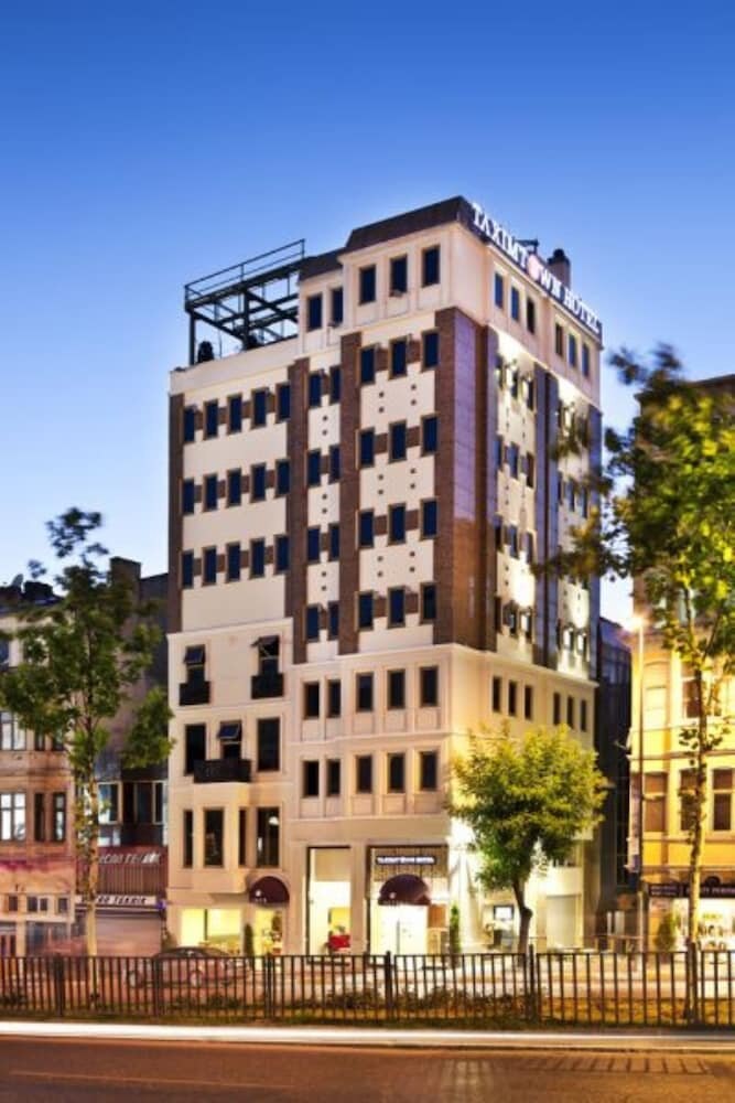 Taximtown Hotel - Tap to explore photos