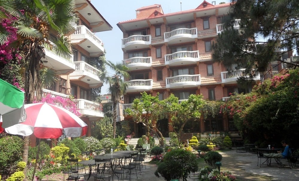 Hotel Nirvana Garden - Tap to explore photos