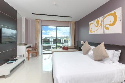 The Charm Resort Phuket - Tap to explore photos